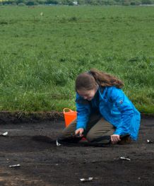 Sofia Skott digging in a field